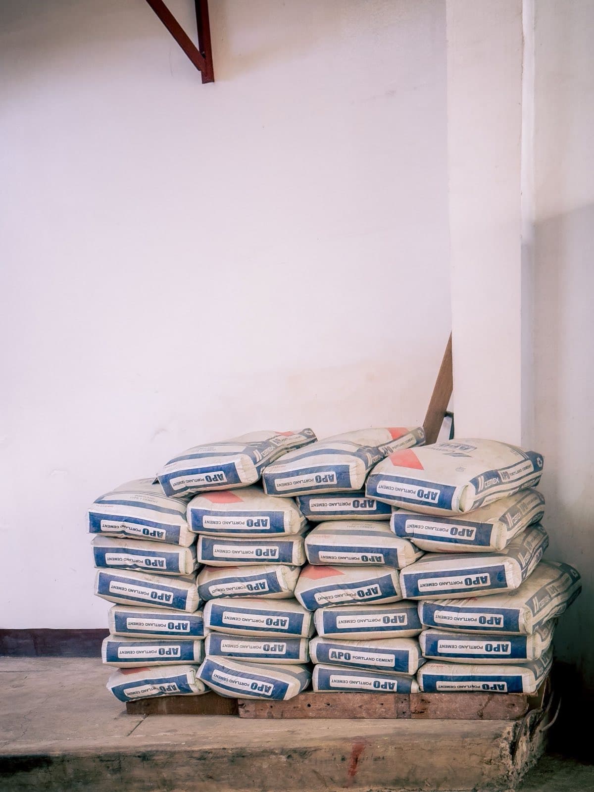 Bags of cement stacked in a store