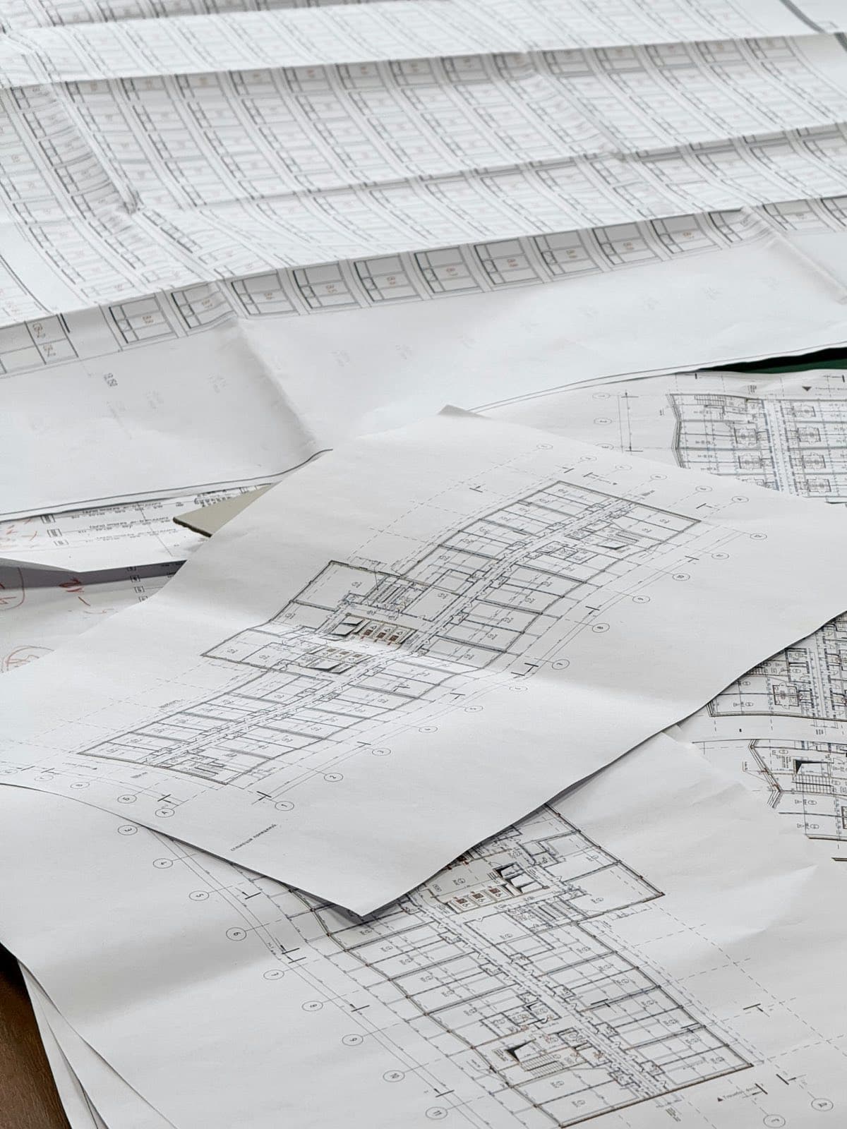 Building drawings spread on a desk